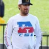 Ryan Gosling Union IATSE Shirt featuring a crisp white short-sleeve button-up design with a relaxed fit, classic collar, left chest embroidered “IATSE” union logo in navy blue, smooth cotton fabric, and straight hem—casual yet polished.